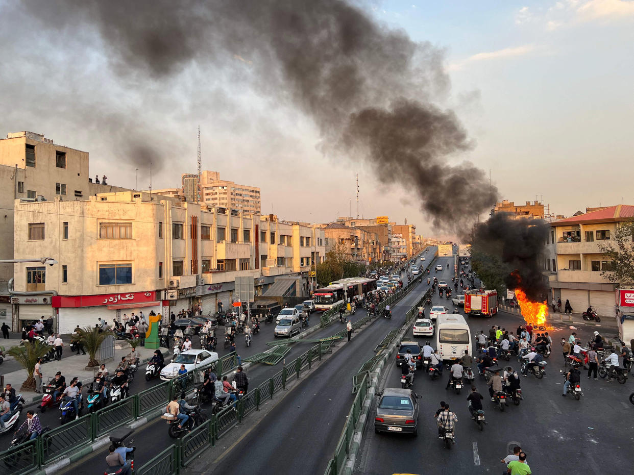 A motorcycle on fire in Iran's capital Tehran on Oct. 8, 2022, amid the biggest wave of social unrest in almost three years