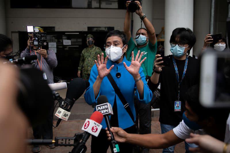 Rappler CEO and Executive Editor Maria Ressa leaves a regional trial court after pleading not guilty to tax evasion charges, in Pasig City