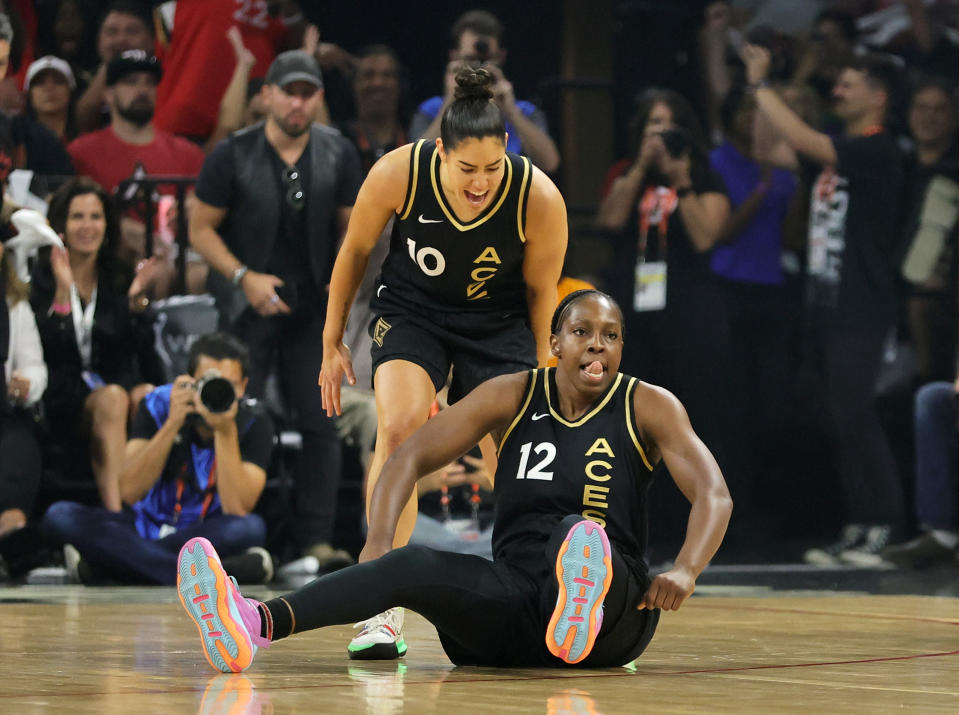 The Las Vegas Aces' Kelsey Plum and Chelsea Gray react after Gray hit a shot and got a flagrant 1 call against the Connecticut Sun in the first quarter of Game 1 of the 2022 WNBA Finals at Michelob ULTRA Arena in Las Vegas on Sept. 11, 2022. (Ethan Miller/Getty Images)