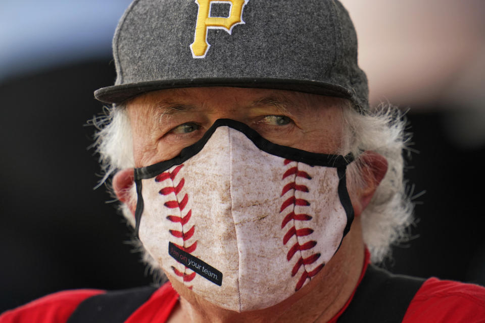 Robert Hahn of Palmetto, Fla., watches a spring training exhibition baseball game between the Pittsburgh Pirates and the Detroit Tigers at LECOM Park in Bradenton, Fla., Tuesday, March 2, 2021. A limited number of fans were permitted to attend the game. (AP Photo/Gene J. Puskar