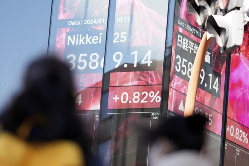 <cite>2024年1月，日本股市從3萬3千點飆上3萬6千點，創下33年來的新高。（美聯社）</cite>