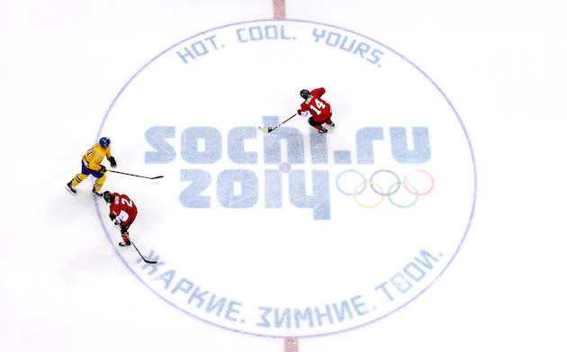 SOCHI, RUSSIA – FEBRUARY 23: Chris Kunitz #14 of Canada handles the puck as teammate Duncan Keith #2 defends against Alexander Steen #20 of Sweden during the Men’s Ice Hockey Gold Medal match on Day 16 of the 2014 Sochi Winter Olympics at Bolshoy Ice Dome on February 23, 2014 in Sochi, Russia. (Photo by Bruce Bennett/Getty Images)