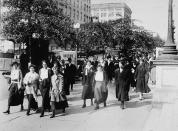 Women from the Department of War take 15-minute walks to breathe in fresh air every morning and night to ward off the influenza virus during World War I, c. 1918. (Photo by Hulton Archive/Getty Images)