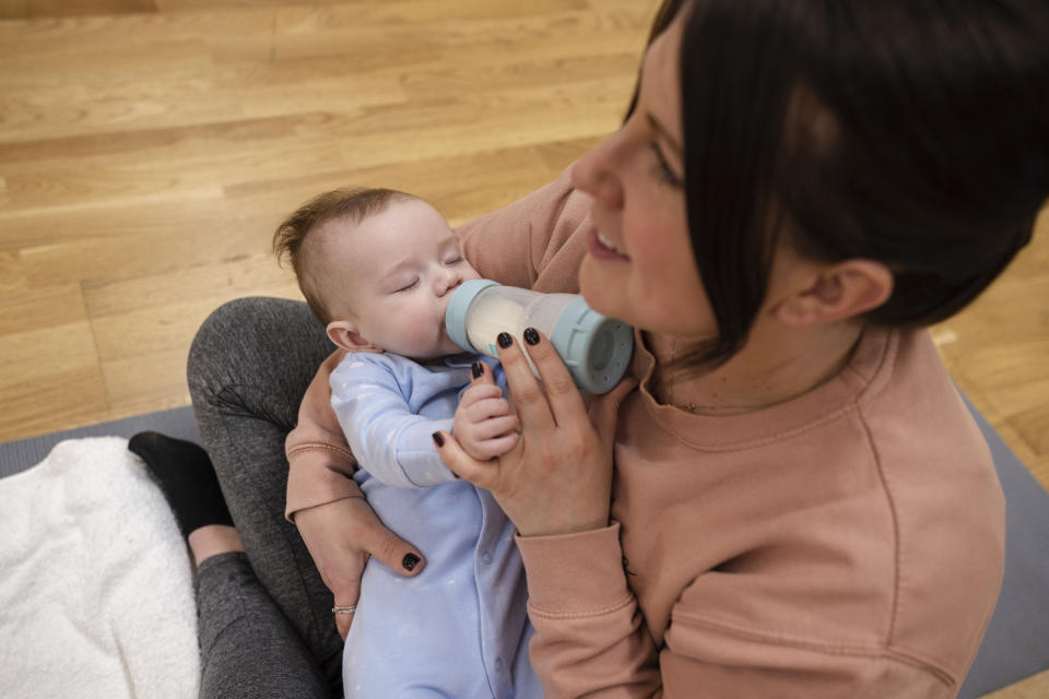 baby drinking from a bottle