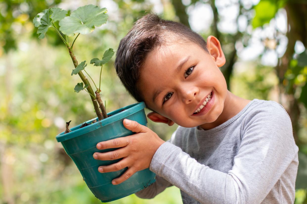 A small plant for a big future: Child celebrates Earth Day with a gift to nature