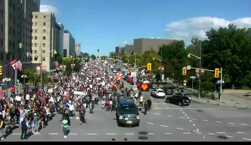 Demonstrators march south on Elgin Street at Laurier Avenue. (City of Ottawa - image credit)