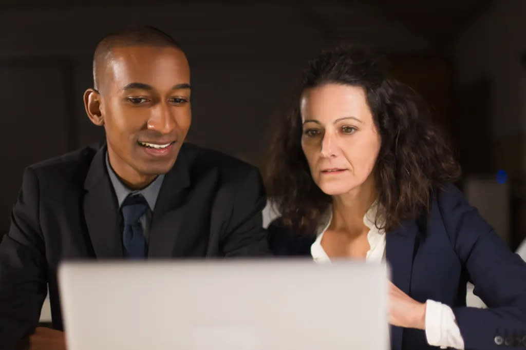 A financial advisor reviewing a real estate portfolio with a client.