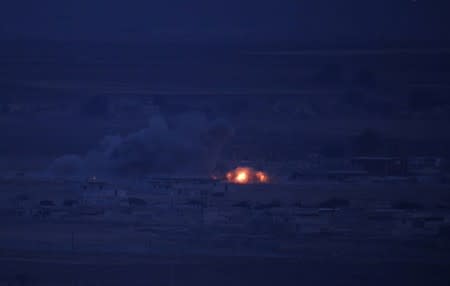 Explosion over the Syrian town of Ras al-Ain as seen from the Turkish border town of Ceylanpinar