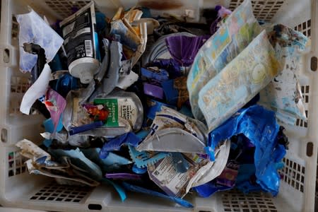 The Wider Image: Cash for trash: Indonesia village banks on waste recycling