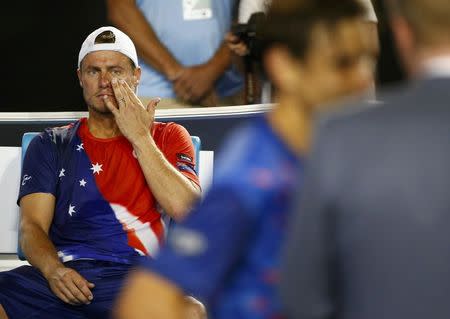 Australia's Lleyton Hewitt sits in his chair as Spain's David Ferrer is interviewed after Ferrer won their second round match at the Australian Open tennis tournament at Melbourne Park, Australia, January 21, 2016. REUTERS/Thomas Peter