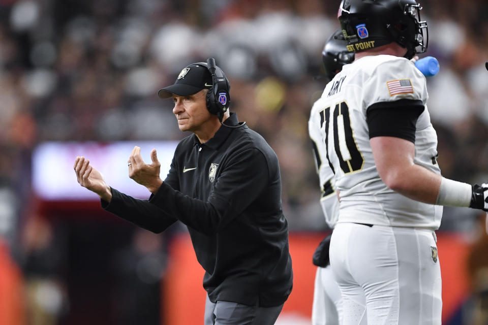 Army head coach Jeff Monken gestures to his players during the first half of an NCAA college football game against Syracuse in Syracuse, N.Y., Saturday, Sept. 23, 2023. (AP Photo/Adrian Kraus)