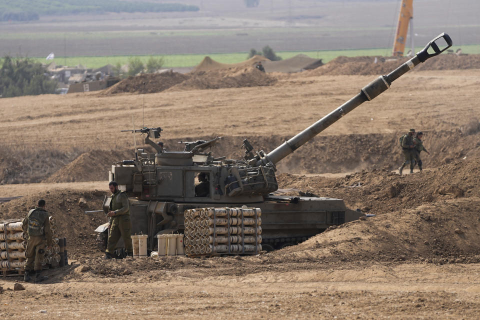An Israeli mobile artillery unit is seen in a position near the Israel-Gaza border, Israel, Saturday, Oct. 28, 2023. Israel on Saturday expanded its ground operation in Gaza with infantry and armored vehicles backed by "massive" strikes from the air and sea, including the bombing of Hamas tunnels, a key target in its campaign to crush the territory's ruling group after its bloody incursion in Israel three weeks ago. (AP Photo/Ohad Zwigenberg)