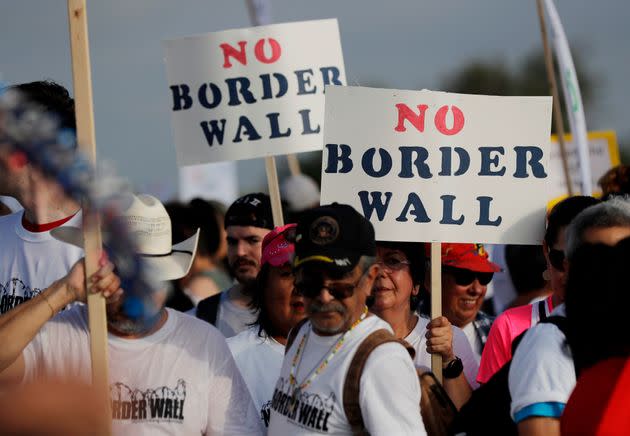 People are seen demonstrating against the construction of a border wall on the Rio Grande that separates Texas from Mexico in Mission, Texas, in 2017. (Photo: via Associated Press)