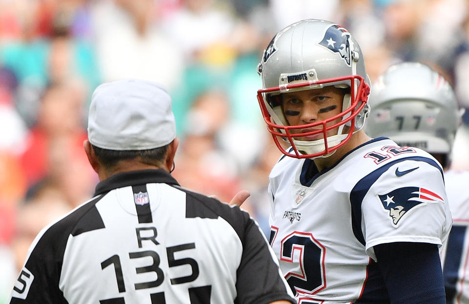 MIAMI, FL - DECEMBER 09:  Tom Brady #12 of the New England Patriots talks to referee Pete Morelli #135 in the first half against the Miami Dolphins at Hard Rock Stadium on December 9, 2018 in Miami, Florida.  (Photo by Mark Brown/Getty Images)