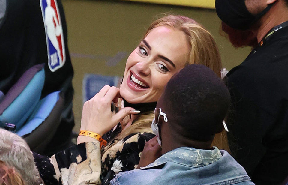 Adele smiles at Rich Paul during Game 5 of the NBA Finals