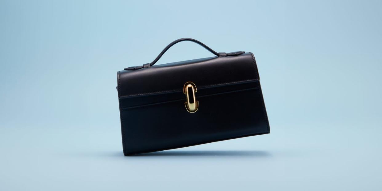 a black briefcase with a gold ring