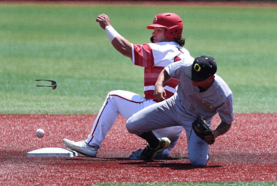 U of L's Dalton Rushing (20) was safe at second base against Oregon's Gavin Grant (5) who was unable to handle the throw during NCAA Regional play at Jim Patterson Stadium in Louisville, Ky. on June 5, 2022.