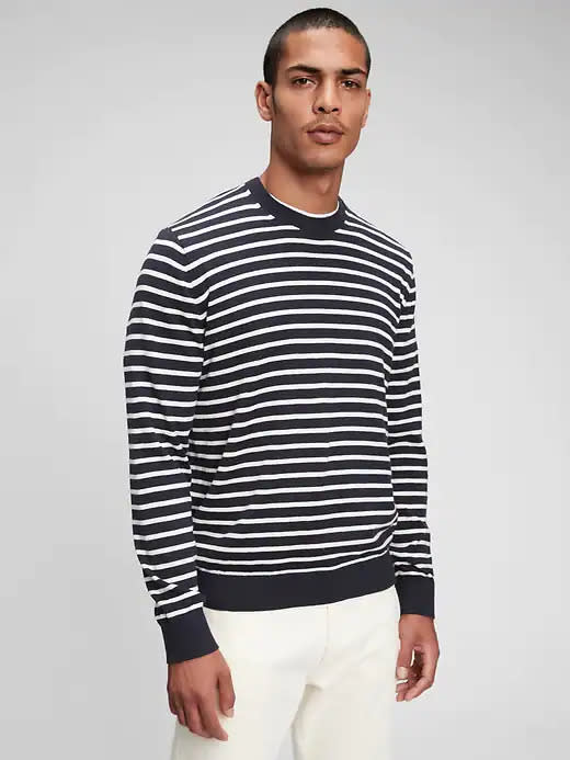 model wears navy blue and white Mainstay Striped Crewneck Sweater. Image via Gap.