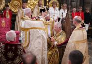 <p>The Archbishop of Canterbury Justin Welby places the St Edward's Crown onto the head of Britain's King Charles III during the Coronation Ceremony inside Westminster Abbey in central London on May 6, 2023. - The set-piece coronation is the first in Britain in 70 years, and only the second in history to be televised. Charles will be the 40th reigning monarch to be crowned at the central London church since King William I in 1066. Outside the UK, he is also king of 14 other Commonwealth countries, including Australia, Canada and New Zealand. Camilla, his second wife, will be crowned queen alongside him and be known as Queen Camilla after the ceremony. (Photo by Victoria Jones / POOL / AFP) (Photo by VICTORIA JONES/POOL/AFP via Getty Images)</p> 