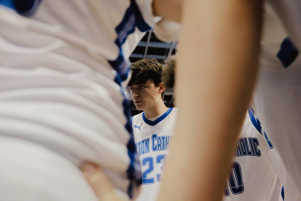 Father Tolton's Blake Pingeton (23) huddles with the Trailblazers after the 2022 Class 4 state championship game at JQH Arena in Springfield.