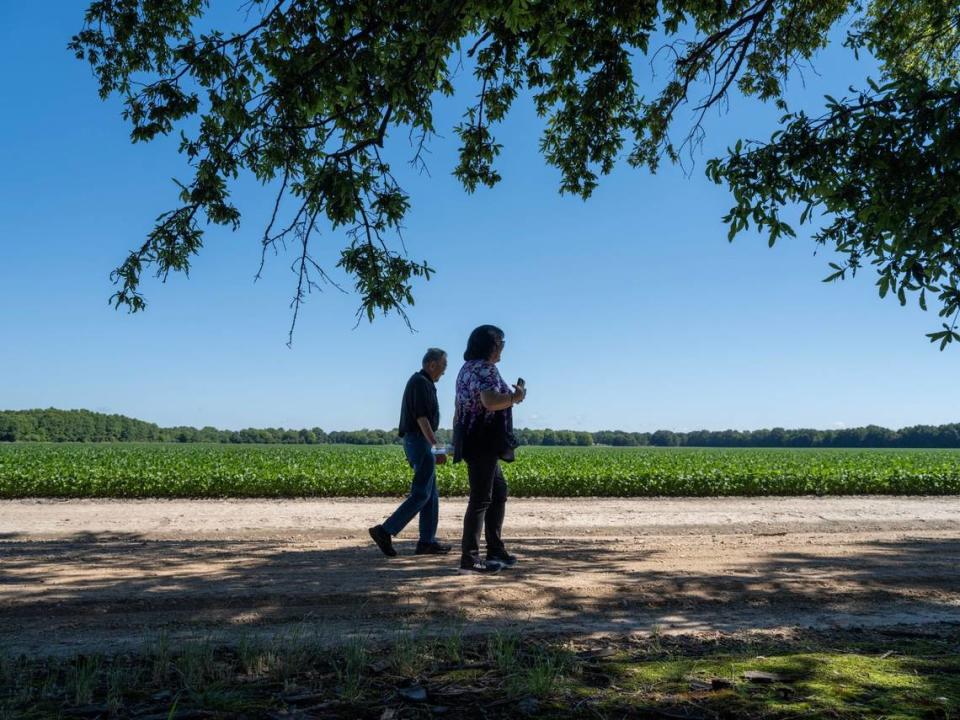 Sacramento resident Mits Yamamoto, 98, walks with his daughter Ginny Syphx on the site of the the Jerome Incarceration Camp in June in Jerome, Arkansas. He lived there during the duration of WWII and the camp held over 8,497 Japanese Americans from October 6, 1942, until June 30, 1944.