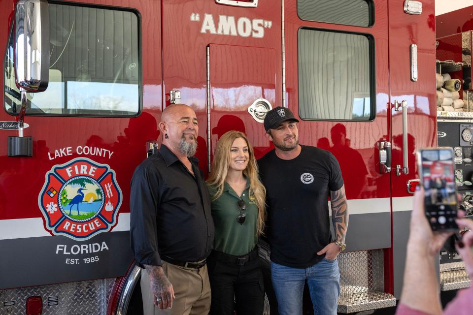 Amos Roach's son Jerry (left), granddaughter Brittney and grandson Michael Ray attended the dedication ceremony at Station 21 in Eustis on Monday.