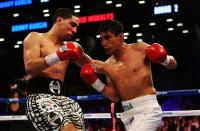 NEW YORK, NY - OCTOBER 20: Danny Garcia and Erik Morales exchange punches during their WBC/WBA junior welterweight title at the Barclays Center on October 20, 2012 in the Brooklyn Borough of New York City. (Photo by Al Bello/Getty Images for Golden Boy Promotions)