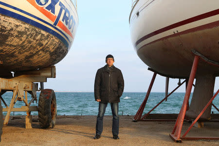 Andrei Lukinykh, 46, engineer and supporter of presidential candidate Vladimir Putin, poses for a picture in Yevpatoriya, Crimea, February 20, 2018. "I am going to vote, because I want stability. As the saying goes, you don't change your horses when crossing a river (at a turning point, during a difficult time)," said Lukinykh. "Unlike the others, my candidate can provide the stability that's needed." REUTERS/Pavel Rebrov