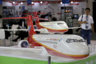 FILE PHOTO: Models of the ARJ21 regional jet from Commercial Aircraft Corp of China (COMAC) are displayed at the Aviation Expo China 2015 in Beijing, China, September 16, 2015. REUTERS/Jason Lee/File Photo