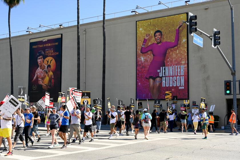 Members of SAG-AFTRA and WGA walk the picket line at the SAG-AFTRA and WGA strike at Warner Bros. Studio on August 18, 2023 in Burbank, California. (Photo by Gilbert Flores/Variety via Getty Images)