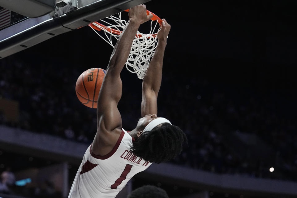 Arkansas guard Ricky Council IV (1) dunks in the second half of an NCAA college basketball game against Oklahoma, Saturday, Dec. 10, 2022, in Tulsa, Okla. (AP Photo/Sue Ogrocki)