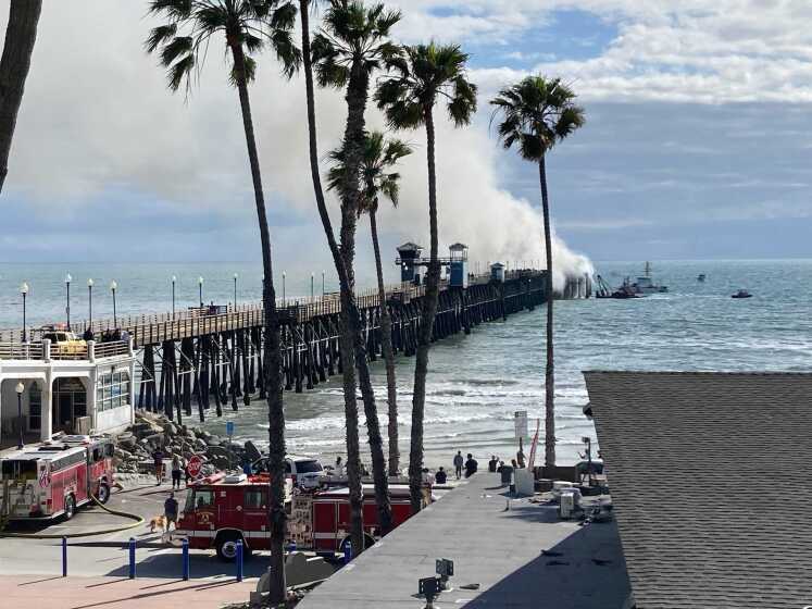Firefighters and others quickly responded to a fire at the end of Oceanside Pier mid-afternoon Thursday
