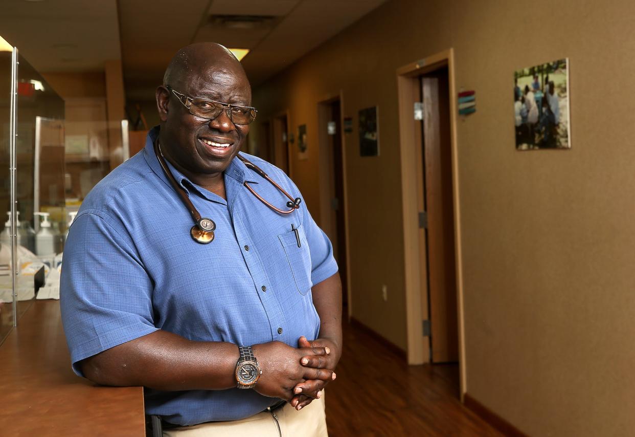 Dr. Benson Bonyo poses for a portrait in his private practice in Akron on Wednesday.