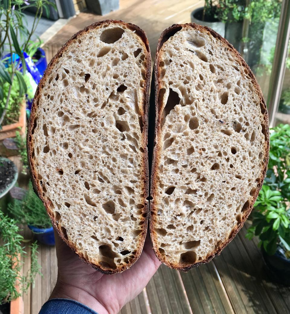 A freshly-baked loaf of sourdough bread appears at a home in London. With millions of people across the globe working at home due to lockdown measures imposed during the coronavirus pandemic, many people are choosing to make their own bread, rather than venturing to the local store to buy their weekly fix. (Matt Kemp via AP)