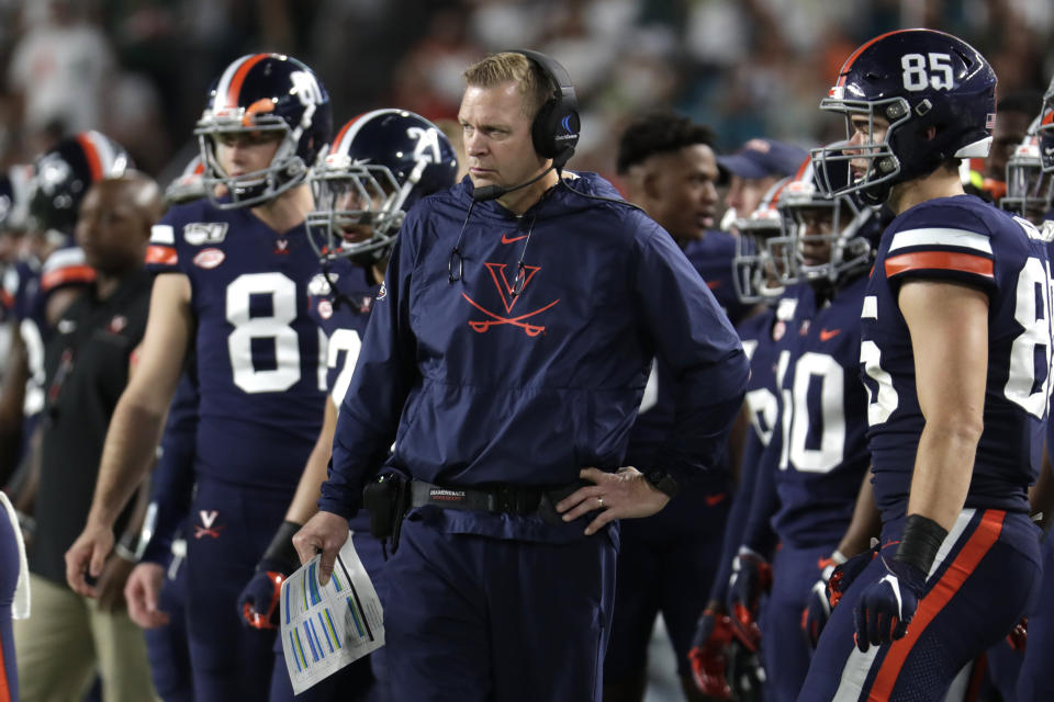 Virginia head coach Bronco Mendenhall watches the first half of an NCAA college football game against Miami, Friday, Oct. 11, 2019, in Miami Gardens, Fla. (AP Photo/Lynne Sladky)