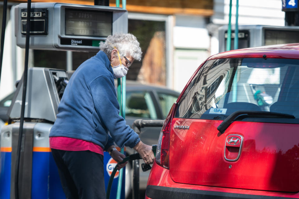 LONDON, UNITED KINGDOM - APRIL 21: A woman fills the petrol tank of her car at an independent petrol station on April 21, 2020 in London, England. The slump in demand for oil due to the ongoing COVID-19 coronavirus pandemic, combined with the failure of oil-producing countries to slow production has resulted in the price of crude oil crashing, with US oil trading briefly at minus $37 a barrel yesterday.  (Photo by Leon Neal/Getty Images)