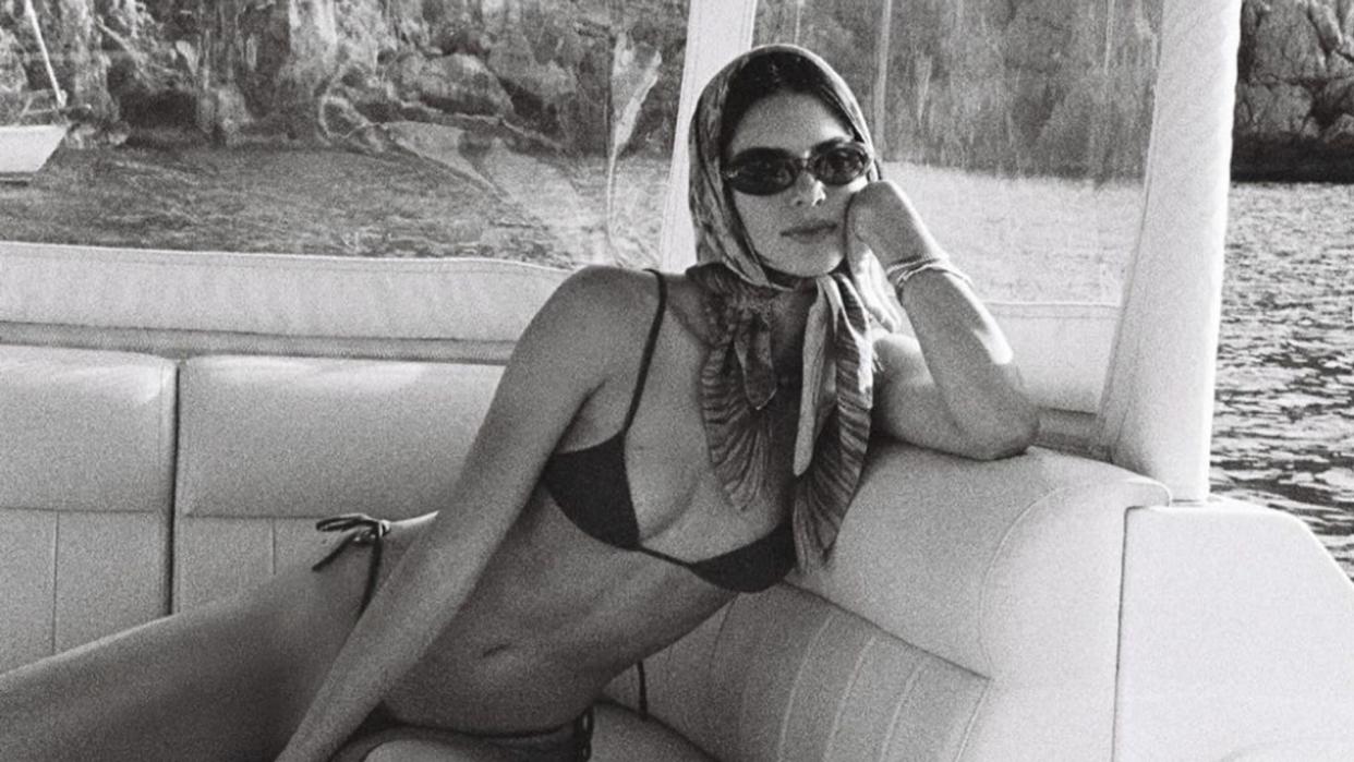 While enjoying a girls' trip in Mallorca, Spain, with her younger sister Kylie, Kendall Jenner showcased the true versatility of a headscarf.
