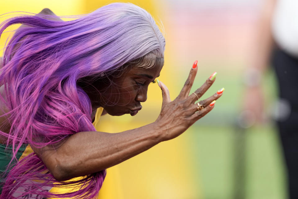 Shelly-Ann Fraser-Pryce, of Jamaica, wins a heat in the women's 100-meter run at the World Athletics Championships on Saturday, July 16, 2022, in Eugene, Ore. (AP Photo/Gregory Bull)