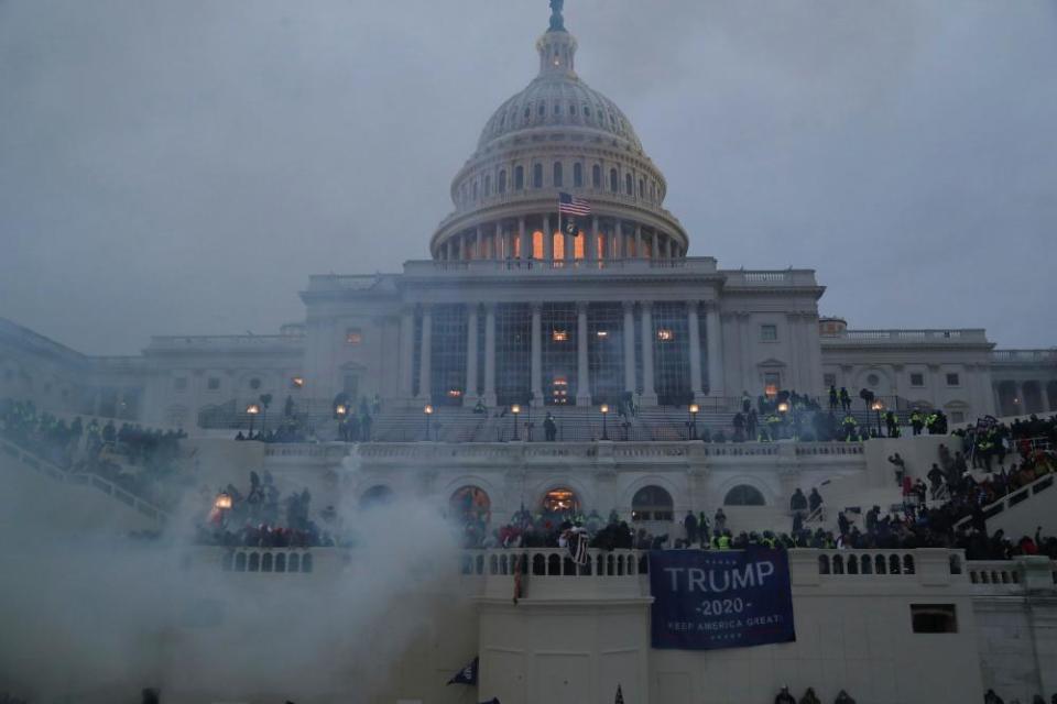 Supporters of U.S. President Donald Trump clash with police officers in front of the U.S. Capitol Building in Washington, U.S., January 6, 2021.