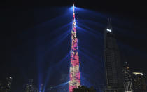 <p>An LED light show illuminates the Burj Khalifa, the world’s tallest building, to celebrate the New Year in Dubai, United Arab Emirates, Monday, Jan. 1, 2018. (Photo: Jon Gambrell/AP) </p>