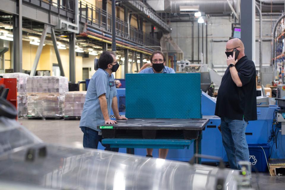 Mailroom packagers and supervisor (from left), Alan Medeiros, Lenny Bowser and Mike Helm work at Treasure Coast Newspaper’s production facility Friday, Jan. 14, 2022, in Port St. Lucie. The men are among a staff of 46 full-time and 27 part-time press and packaging employees who will produce the last newspaper at the facility on Jan. 23, when production moves to Deerfield Beach. The plant opened in 2005 and many employees have spent decades printing Treasure Coast Newspapers at previous locations. 