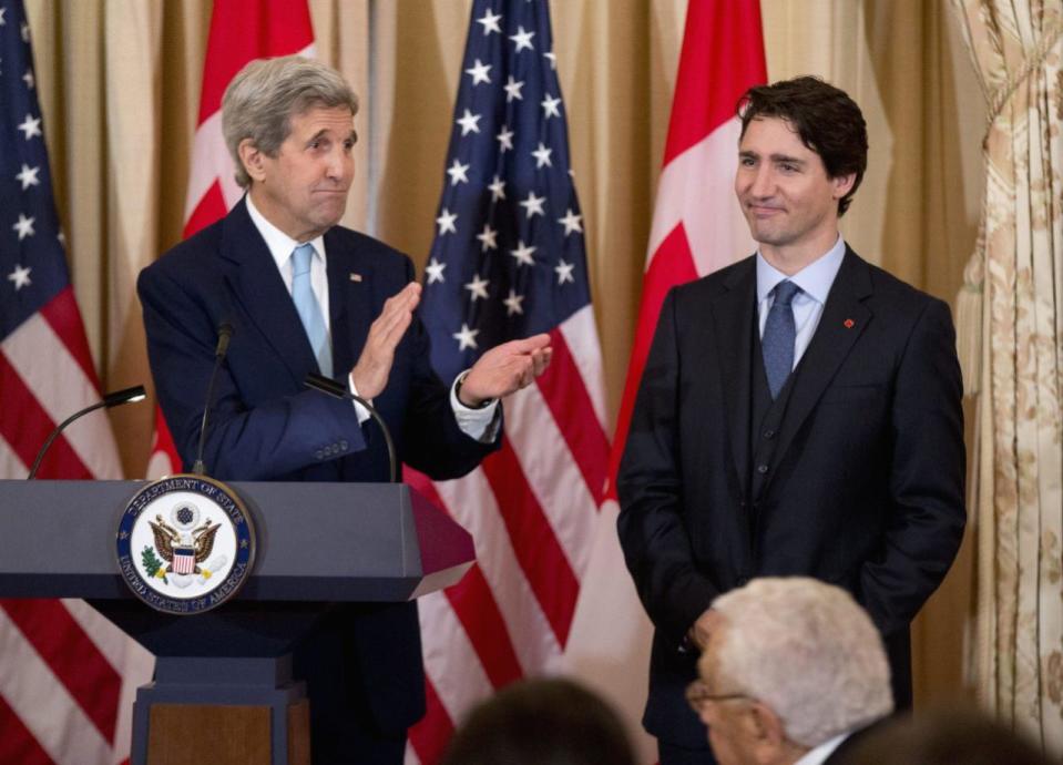 Secretary of State John Kerry applauds Prime Minister Justin Trudeau during a luncheon meeting at the State Department in Washington, Thursday, March 10, 2016. (AP Photo/Manuel Balce Ceneta)