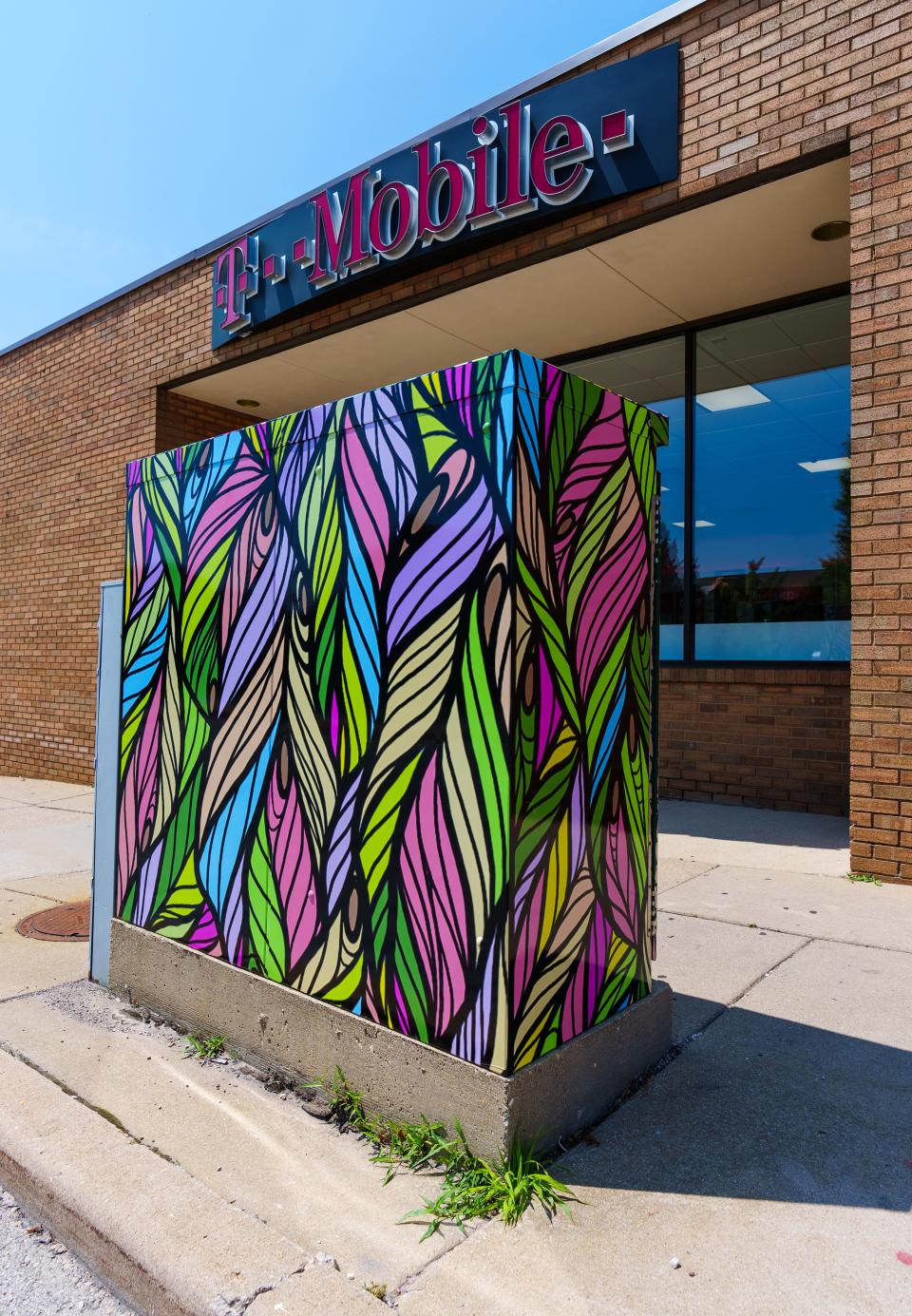A utility box at 70th & Greenfield is wrapped with art by Joseph Juarez as seen on Friday, July 21, 2023. The box is one of 11 selected for the City of West Allis public art utility box program.