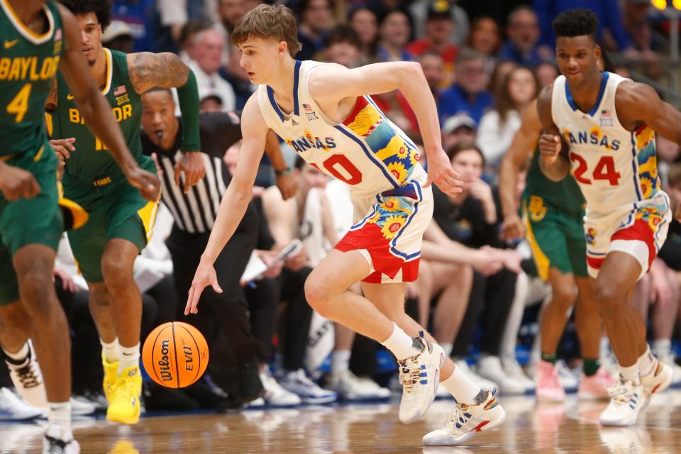 Kansas freshman guard Johnny Furphy (10) makes a play against Baylor during the first half of a game on Feb. 10, 2024 inside Allen Fieldhouse.