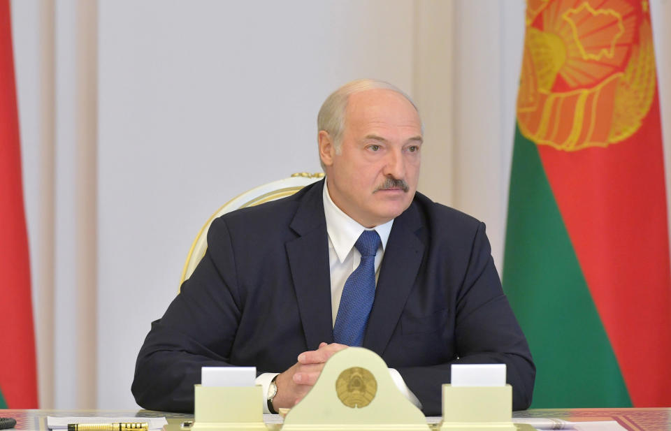 Image: Belarusian President Alexander Lukashenko chairs a meeting with members of the Security Council in Minsk, Belarus (Andrei Stasevich / BelTA / Reuters)