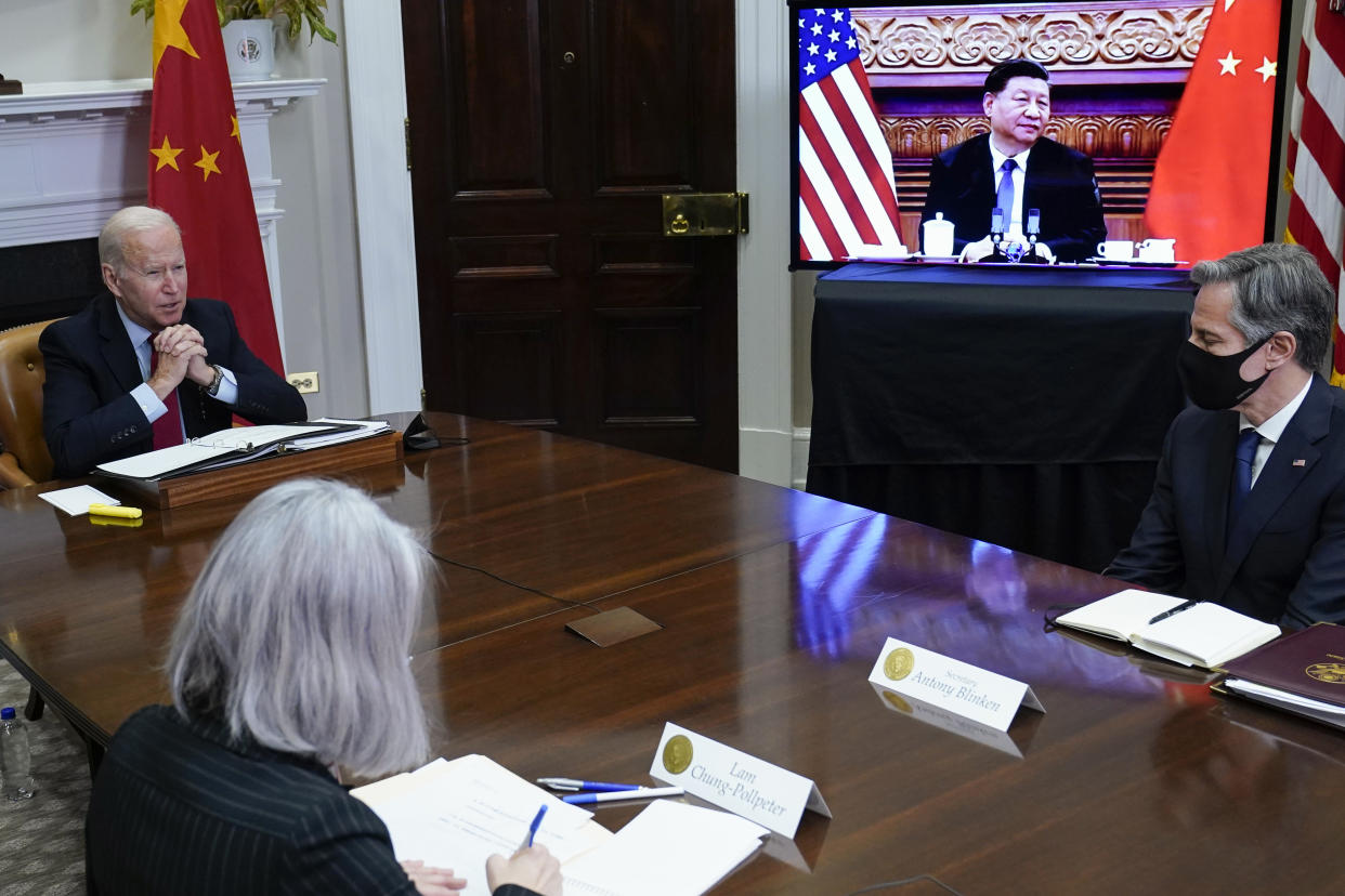 FILE - President Joe Biden meets virtually with Chinese President Xi Jinping from the Roosevelt Room of the White House in Washington, Nov. 15, 2021, as Secretary of State Antony Blinken, right, listens. Secretary of State Antony Blinken has postponed a planned high-stakes weekend diplomatic trip to China as the Biden administration weighs a broader response to the discovery of a high-altitude Chinese balloon flying over sensitive sites in the western United States, a U.S. official said Friday.(AP Photo/Susan Walsh, File)