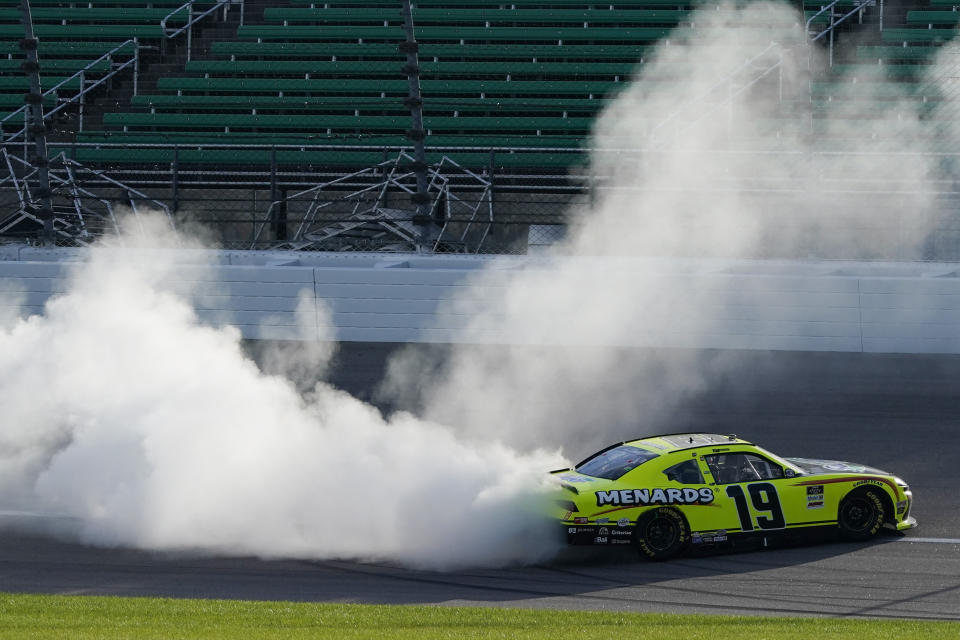 Brandon Jones does a burnout after winning a NASCAR Xfinity Series auto race at Kansas Speedway in Kansas City, Kan., Saturday, July 25, 2020. (AP Photo/Charlie Riedel)