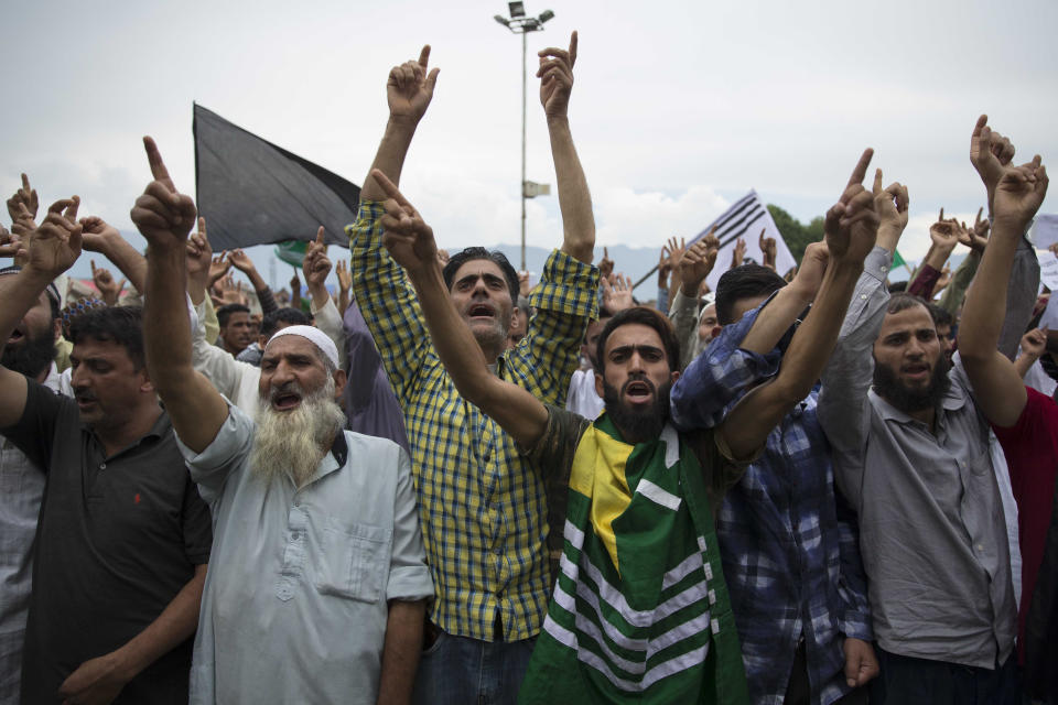 Kashmiri Muslims shout pro-freedom slogans during a demonstration after Friday prayers amid curfew like restrictions in Srinagar, India, Friday, Aug. 16, 2019. Hundreds of people have held a street protest in Indian-controlled Kashmir as India's government assured the Supreme Court that the situation in the disputed region is being reviewed daily and unprecedented security restrictions will be removed over the next few days. (AP Photo/Dar Yasin)