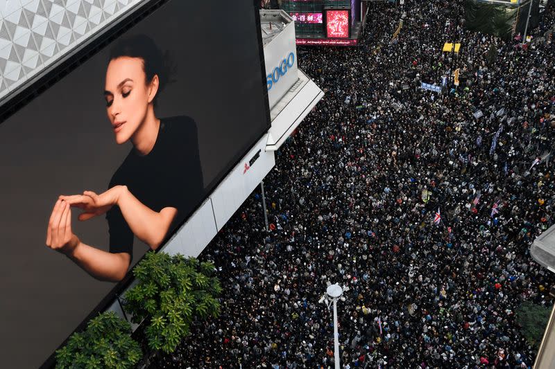 People attend a Human Rights Day march