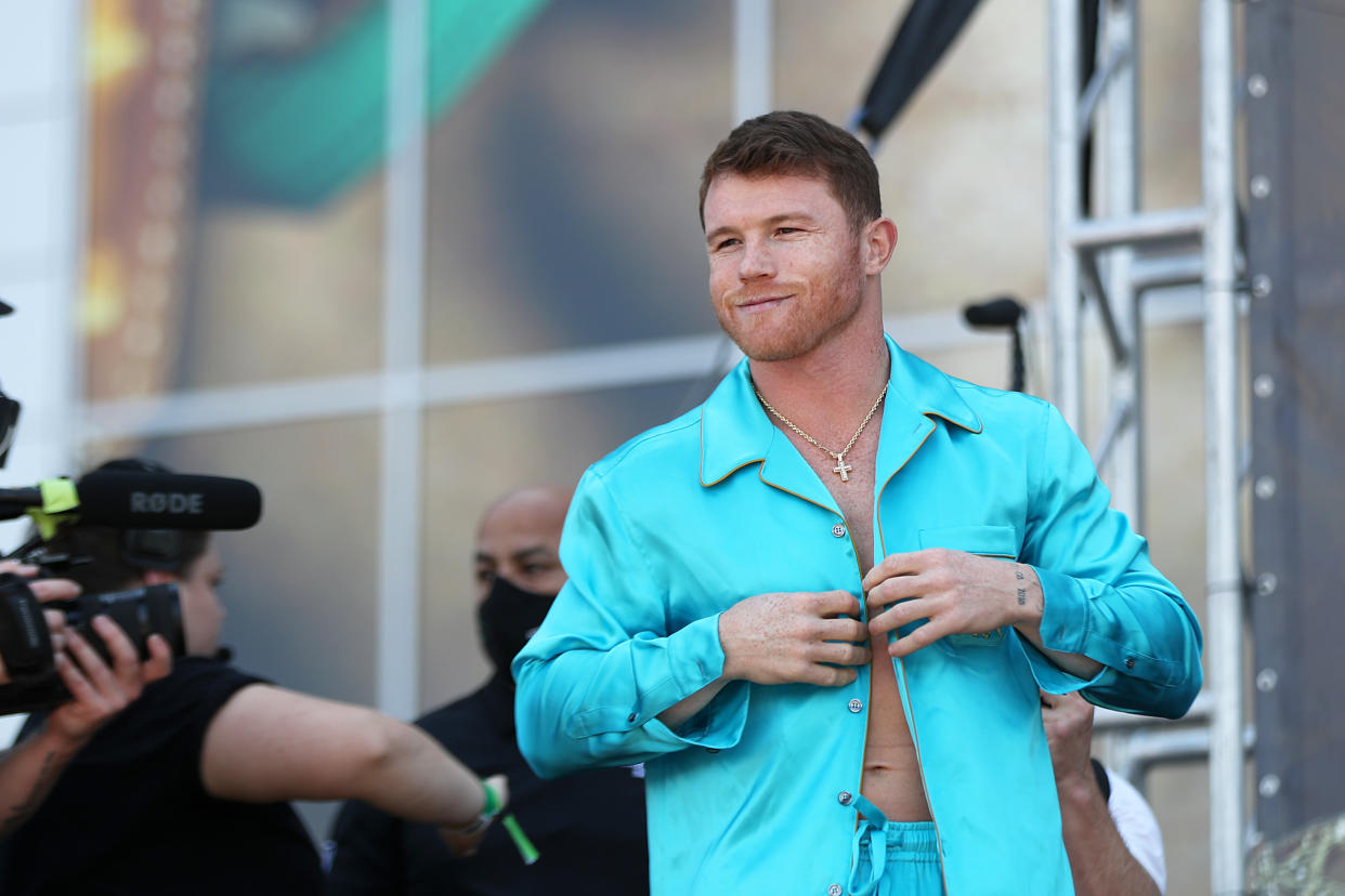 ARLINGTON, TX - MAY 07: Boxer Saul Canelo Alvarez gestures  during the official Weigh-in at AT&T Stadium on May 7, 2021 in Arlington, Texas. (Photo by Omar Vega/Getty Images)